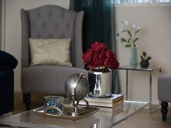 Carpeted living room at Deer Park Apartments